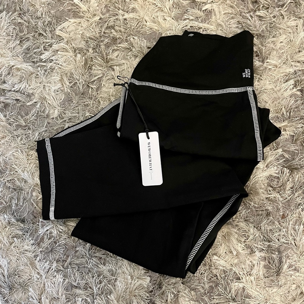 WEWOREWHAT black with white thread leggings
